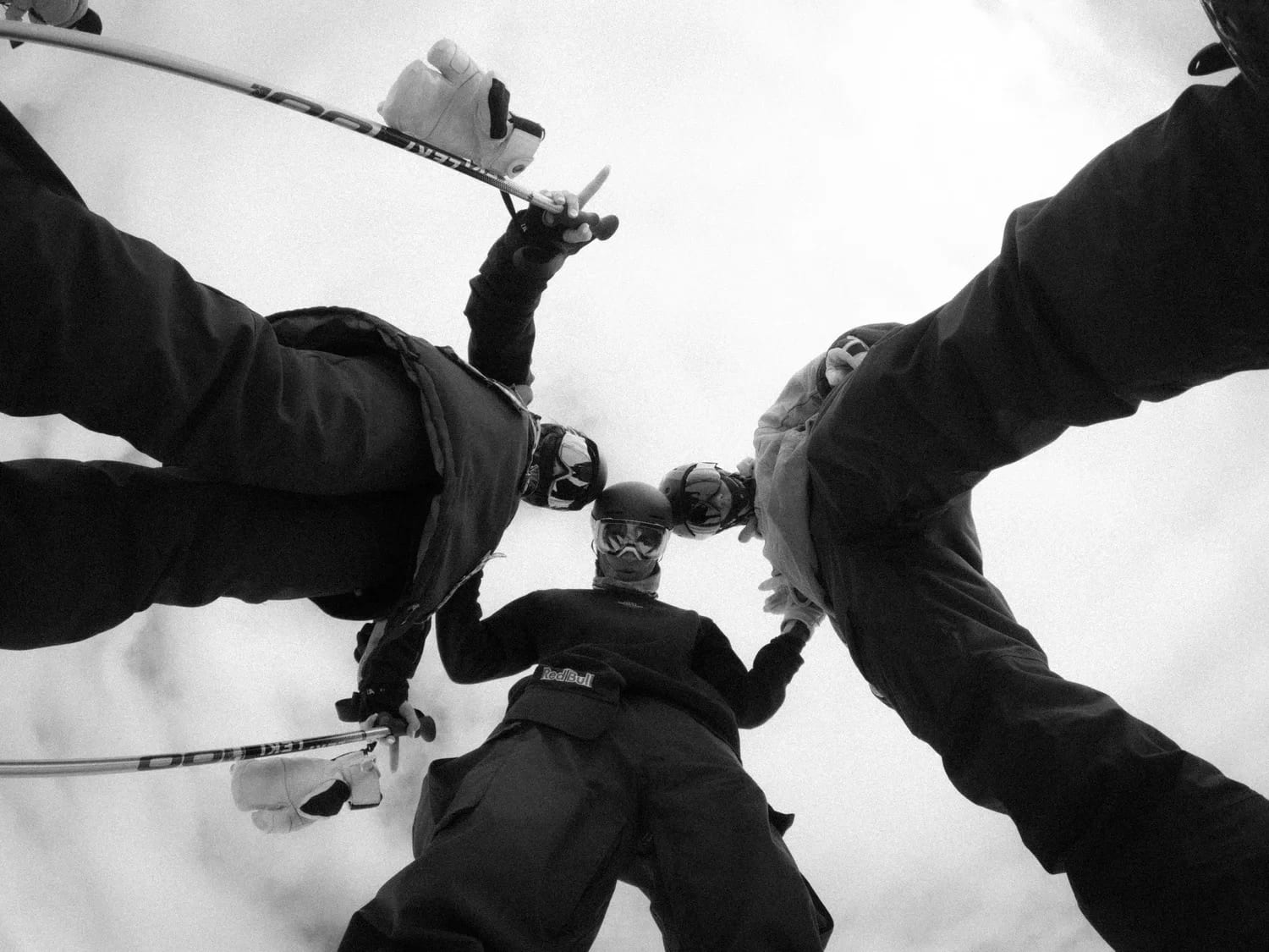 Skiers from below, boots in a circle